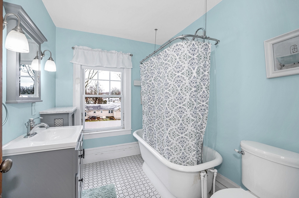 567 Andover Street, Unit A Lowell, MA 01852 - Photo 19 of 35 a bathroom with a sink toilet and shower