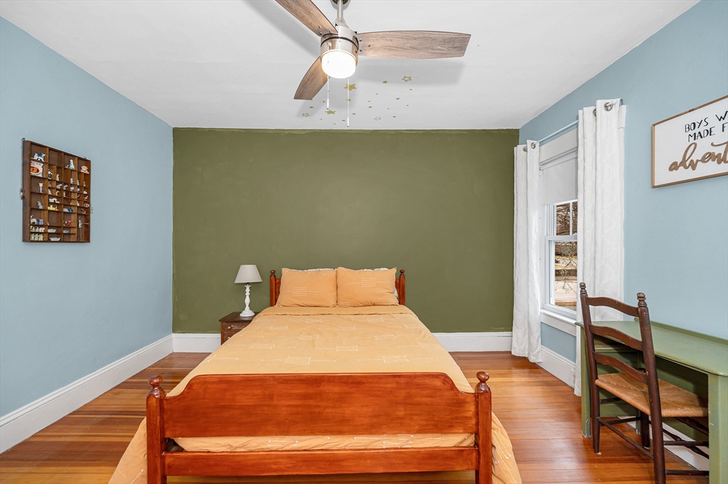 567 Andover Street, Unit A Lowell, MA 01852 - Photo 21 of 35 a bedroom with a bed and a desk