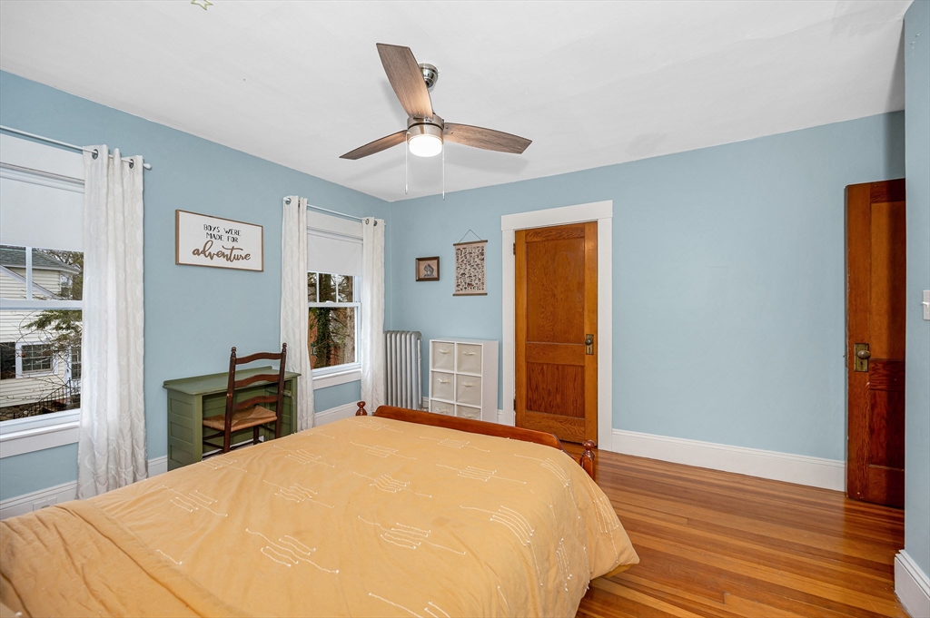 567 Andover Street, Unit A Lowell, MA 01852 - Photo 22 of 35 a bed room with a bed and a television