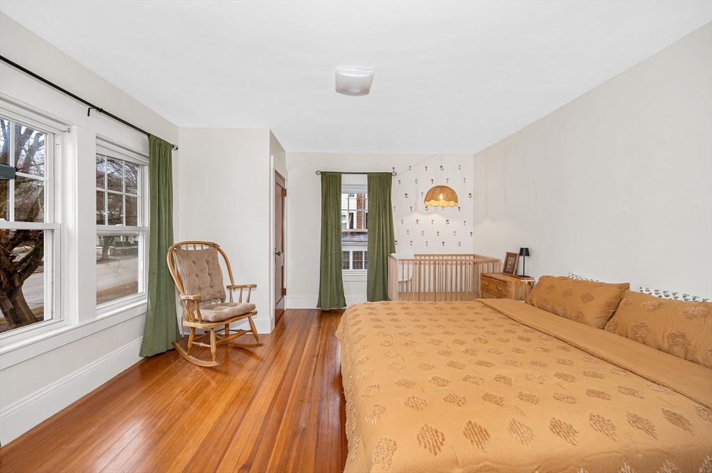 567 Andover Street, Unit A Lowell, MA 01852 - Photo 24 of 35 a bedroom with a bed and a large window