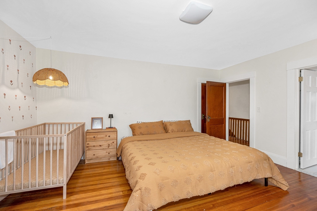 567 Andover Street, Unit A Lowell, MA 01852 - Photo 25 of 35 a bedroom with a bed and a window