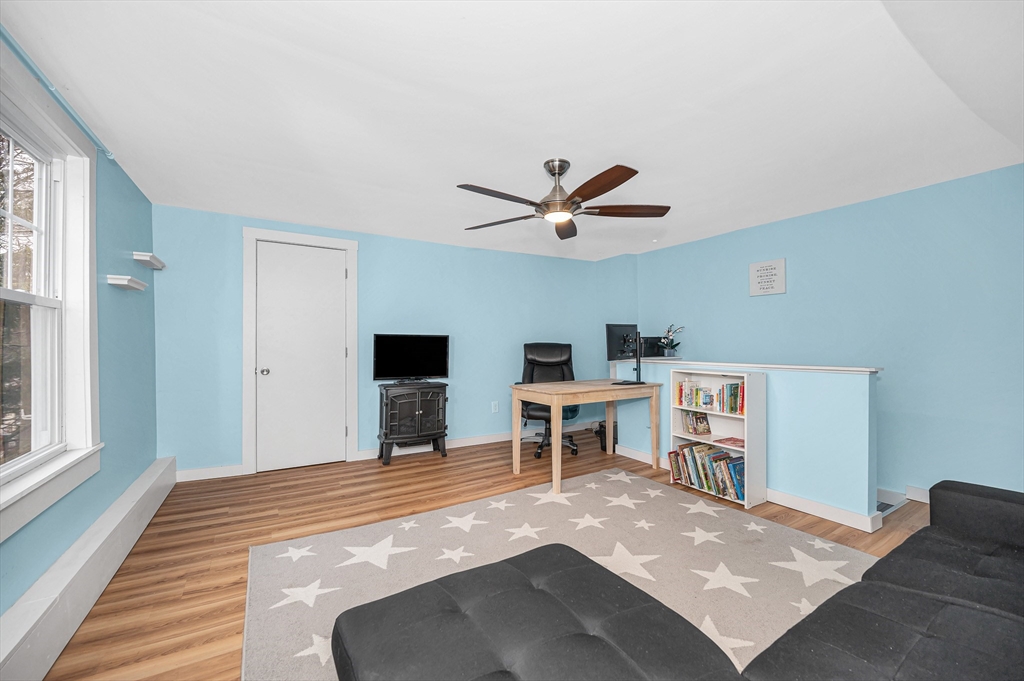 567 Andover Street, Unit A Lowell, MA 01852 - Photo 30 of 35 a view of a livingroom with a workspace