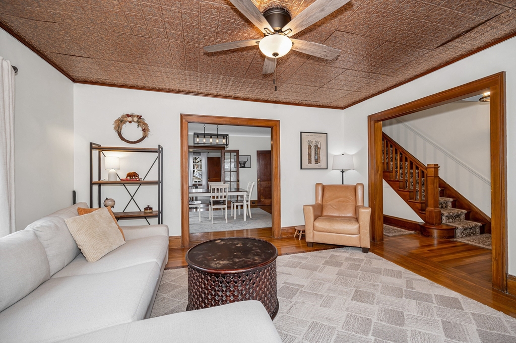 567 Andover Street, Unit A Lowell, MA 01852 - Photo 6 of 35 a living room with furniture and a clock