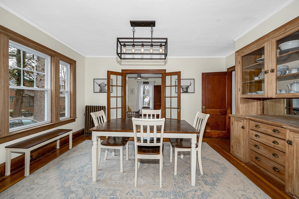 567 Andover Street, Unit A Lowell, MA 01852 - Photo 7 of 35 a view of a dining room with furniture window and wooden floor