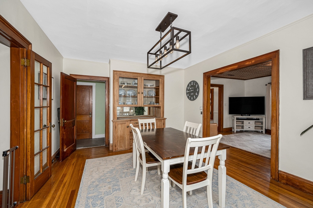 567 Andover Street, Unit A Lowell, MA 01852 - Photo 8 of 35 a view of a dining room with furniture window and wooden floor