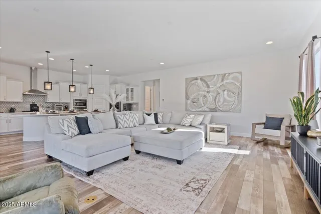 a large kitchen with a table and chairs