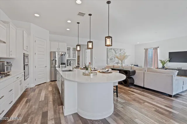 a view of a dining room with furniture and wooden floor