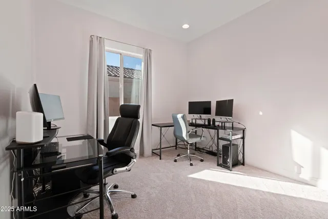 a view of a house with swimming pool and sitting area