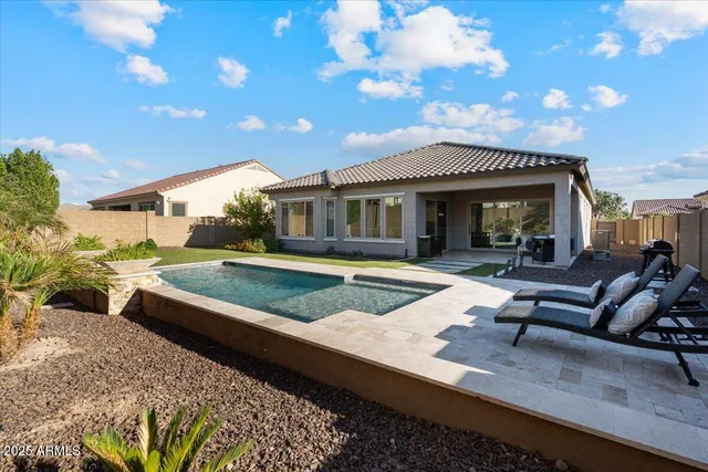 a view of house with yard and entertaining space