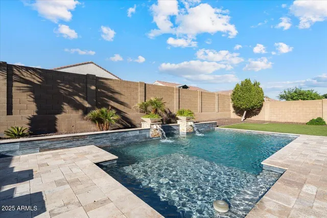 an aerial view of residential houses with a city view