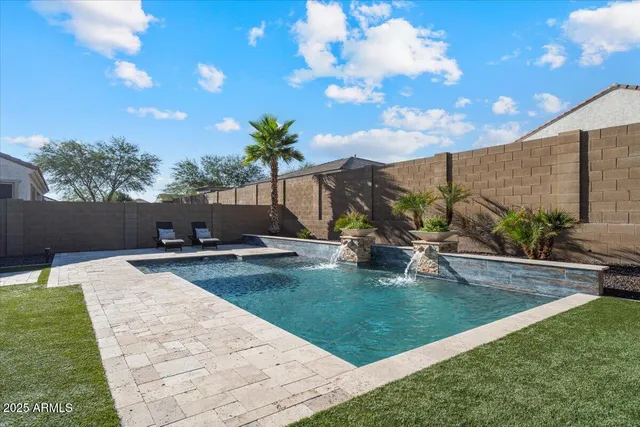 an aerial view of residential houses with city view