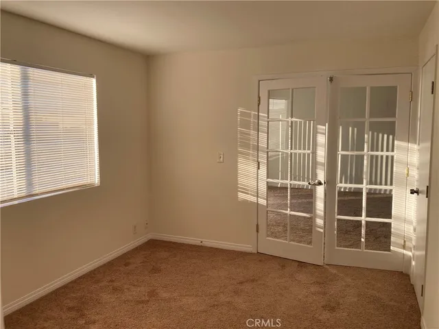 a view of a brick building next to a yard