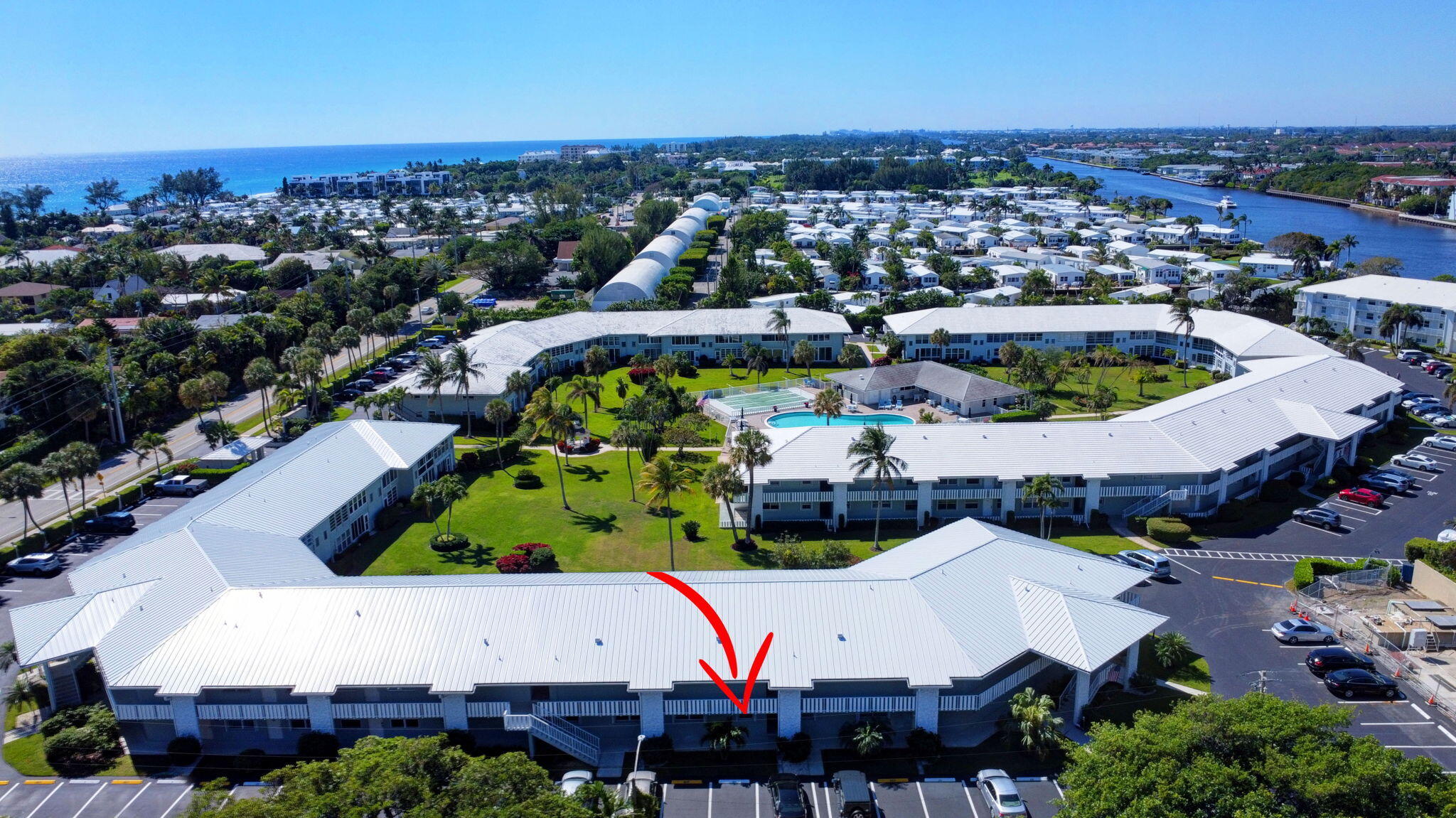 5550 North Ocean Boulevard, Unit 114 Ocean Ridge, FL 33435 - Photo 29 of 54 an aerial view of an swimming pool and outdoor seating