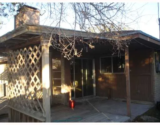 a view of a house with a tree