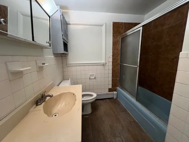 a bathroom with a sink and a shower