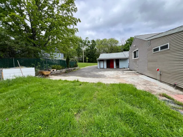 a view of a back yard with a patio