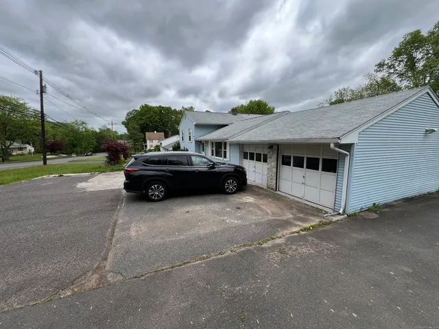 a car parked in front of a house