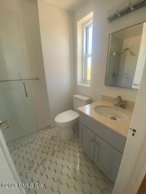 25 West Elm Street, Unit 40 Greenwich, CT 06830 - Photo 22 of 28 a bathroom with a sink toilet and shower