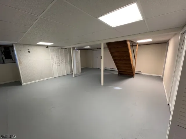 an empty room with a window and a projector