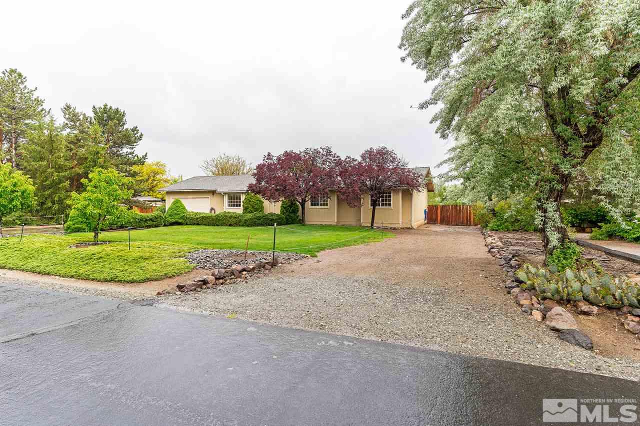 14585 Seminole Trail Reno, NV 89521 - Photo 1 of 15 a view of a house with a big yard and large trees