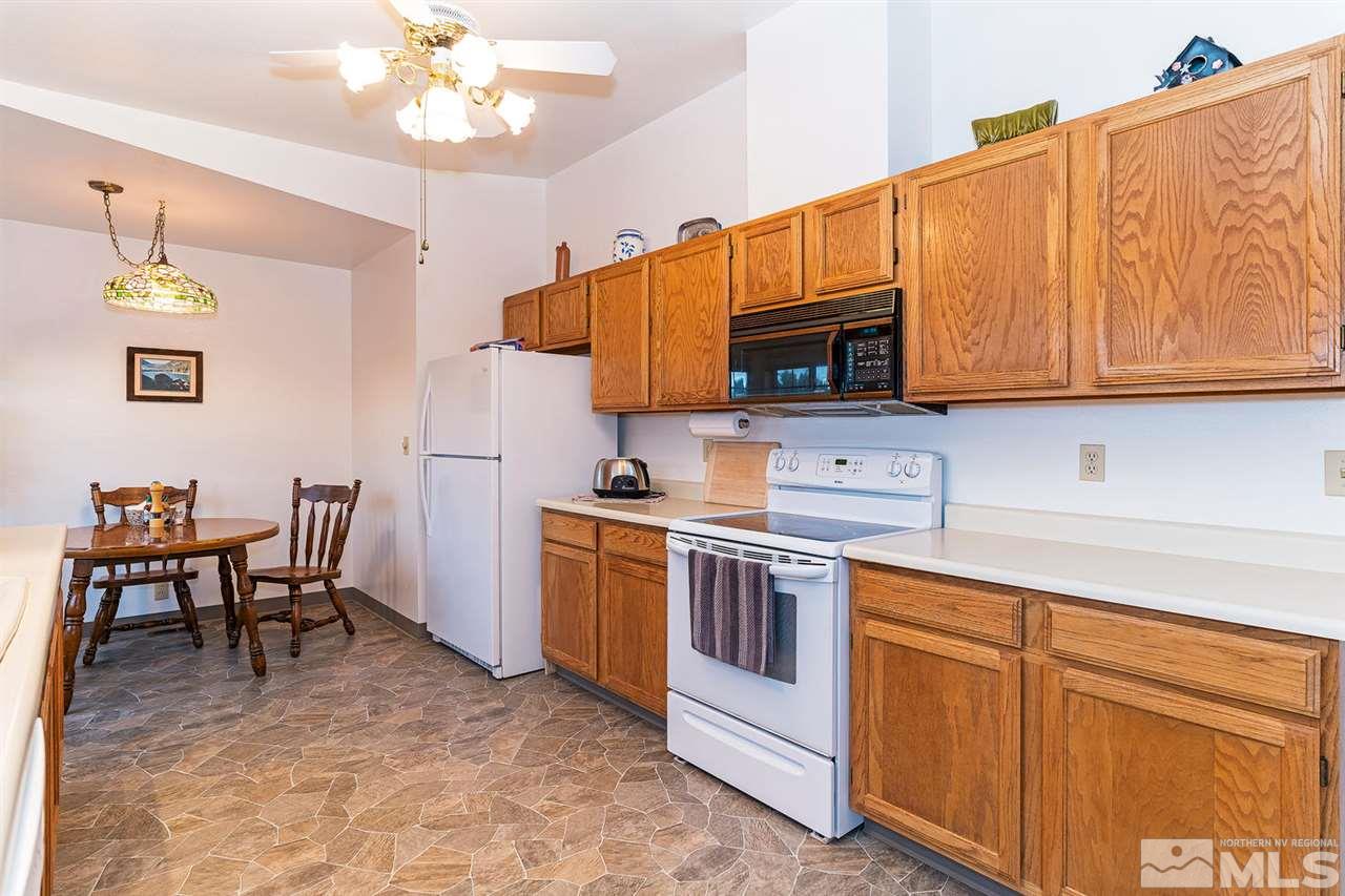 14585 Seminole Trail Reno, NV 89521 - Photo 7 of 15 a kitchen with cabinets a sink and appliances