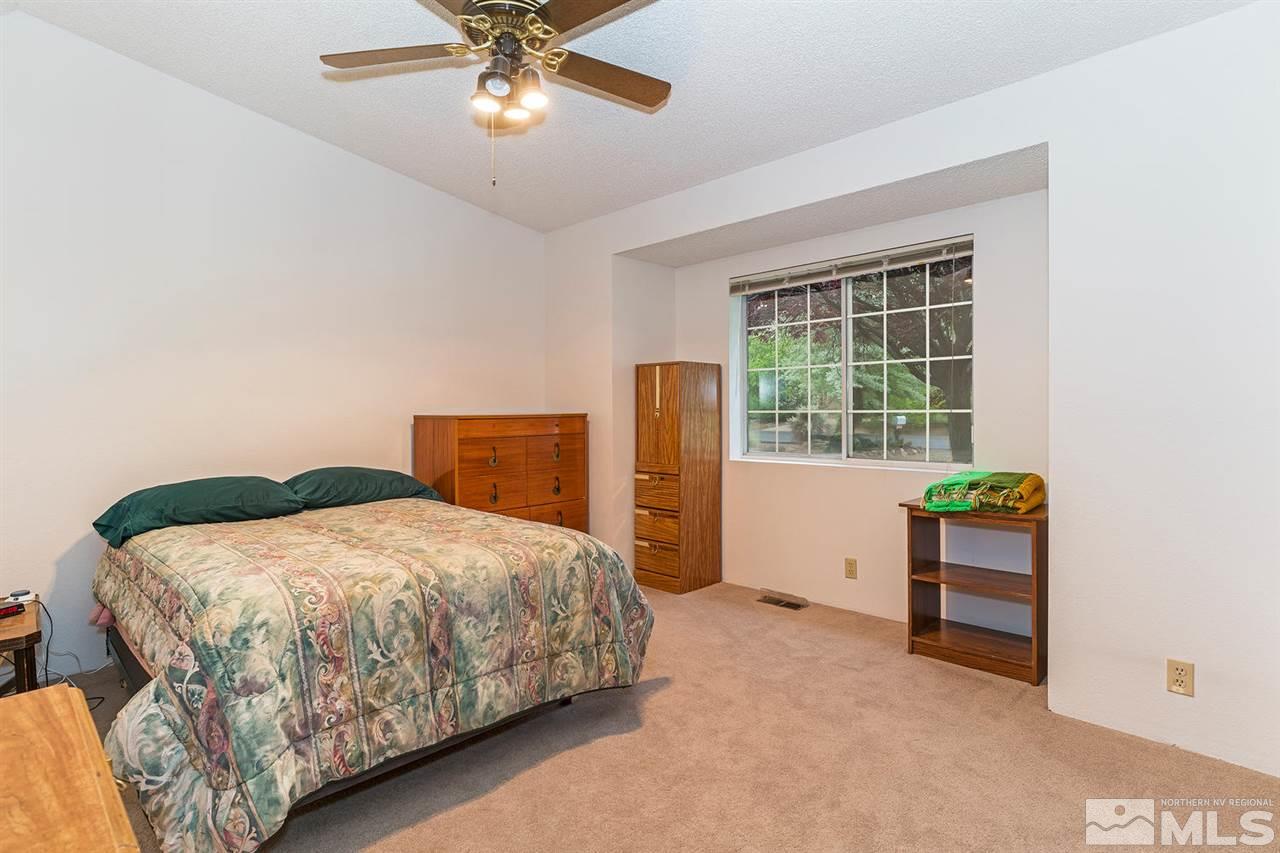 14585 Seminole Trail Reno, NV 89521 - Photo 10 of 15 a bedroom with a bed and a window