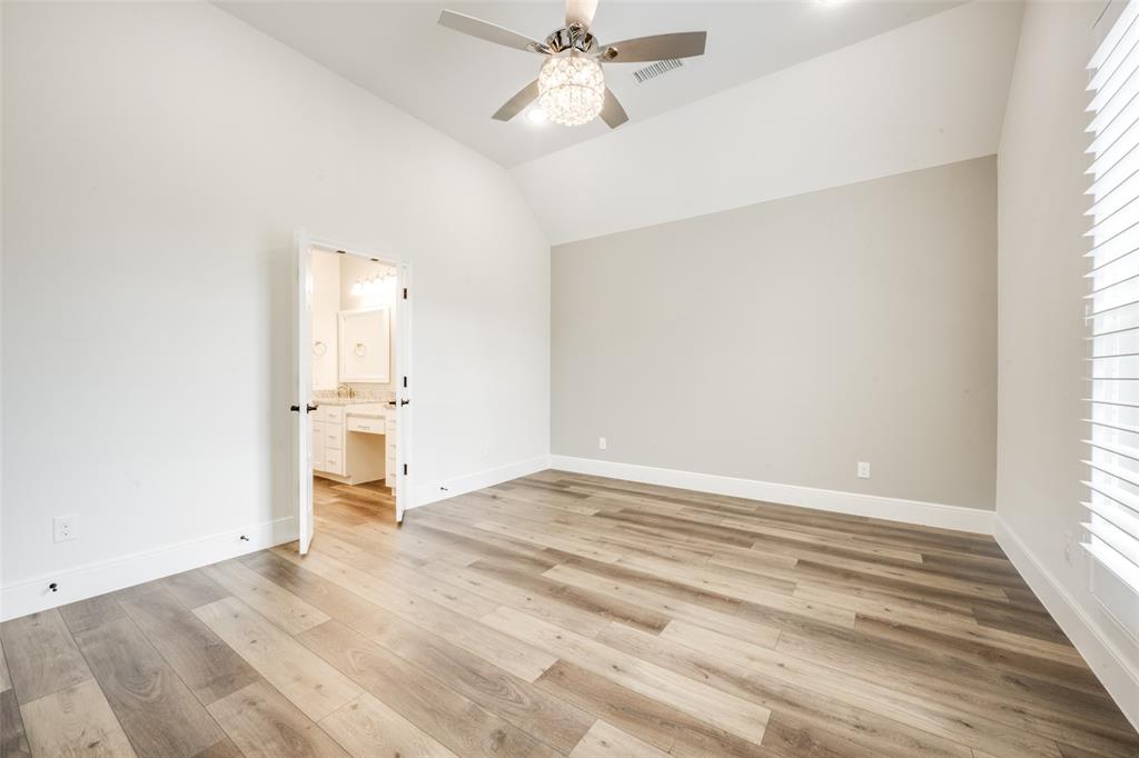 444 Ben Boyd Road Argyle, TX 76226 - Photo 15 of 28 wooden floor in an empty room with a window