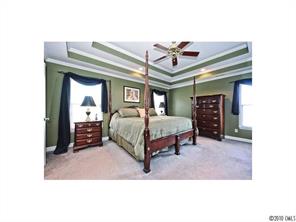 340 Gringley Hill Road Fort Mill, SC 29708 - Photo 5 of 15 a bedroom with a bed and a ceiling fan