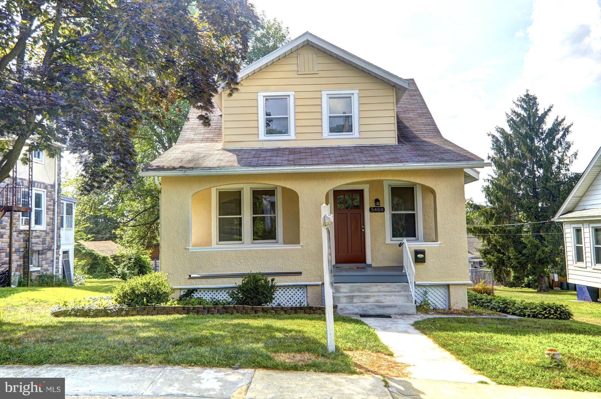 5408 Catalpha Road Baltimore, MD 21214 - Photo 1 of 23 a front view of a house with a yard