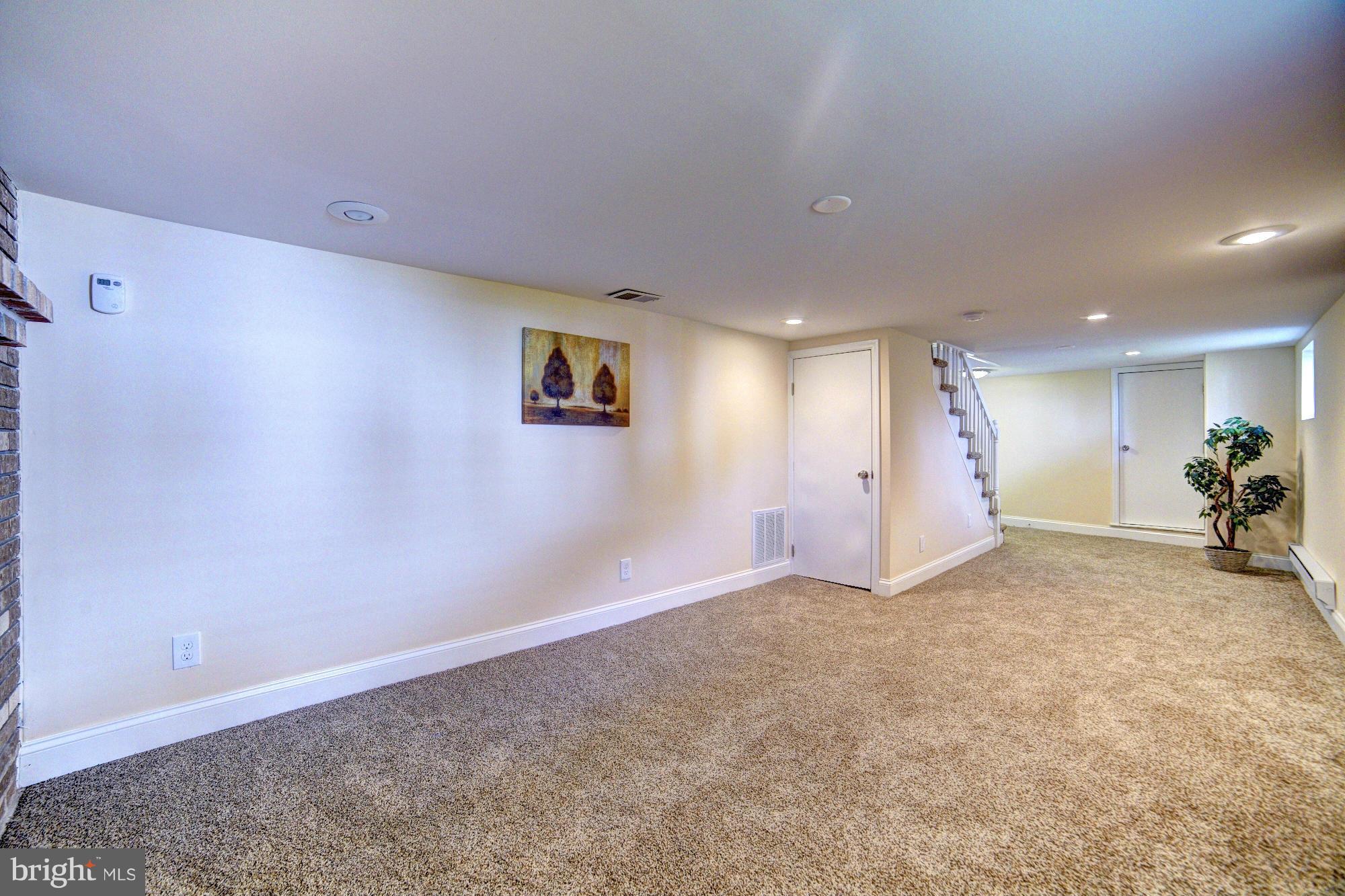 5408 Catalpha Road Baltimore, MD 21214 - Photo 20 of 23 a view of a livingroom with a staircase