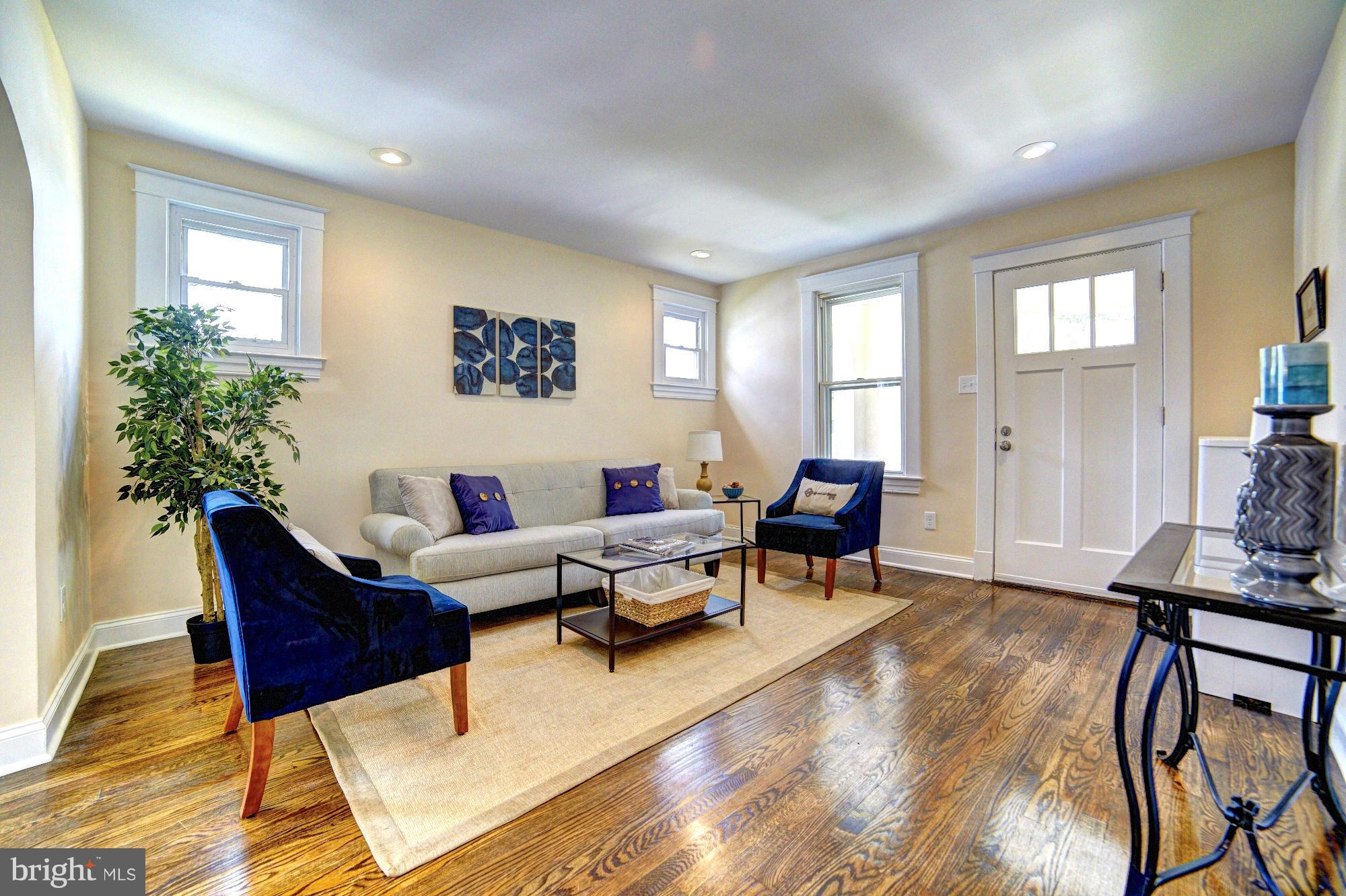 5408 Catalpha Road Baltimore, MD 21214 - Photo 3 of 23 a living room with furniture and wooden floor