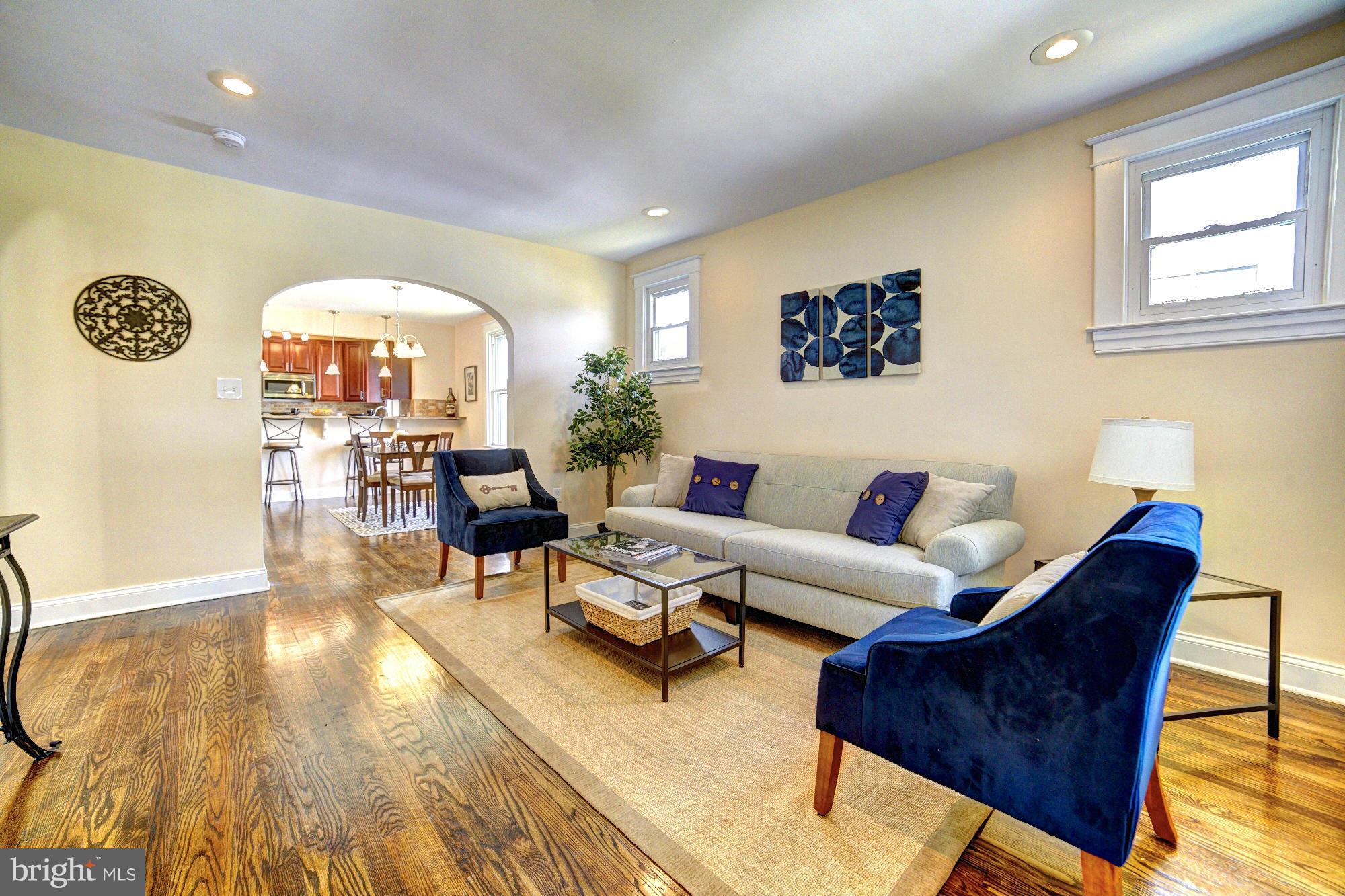 5408 Catalpha Road Baltimore, MD 21214 - Photo 4 of 23 a living room with furniture and a large window