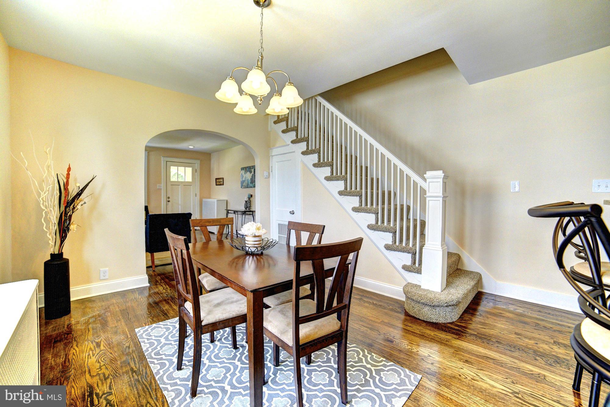 5408 Catalpha Road Baltimore, MD 21214 - Photo 6 of 23 a view of a dining room with furniture and wooden floor