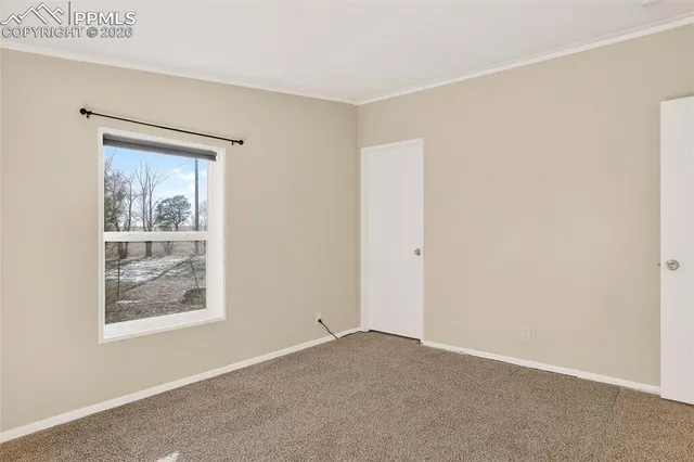a view of an empty room with window