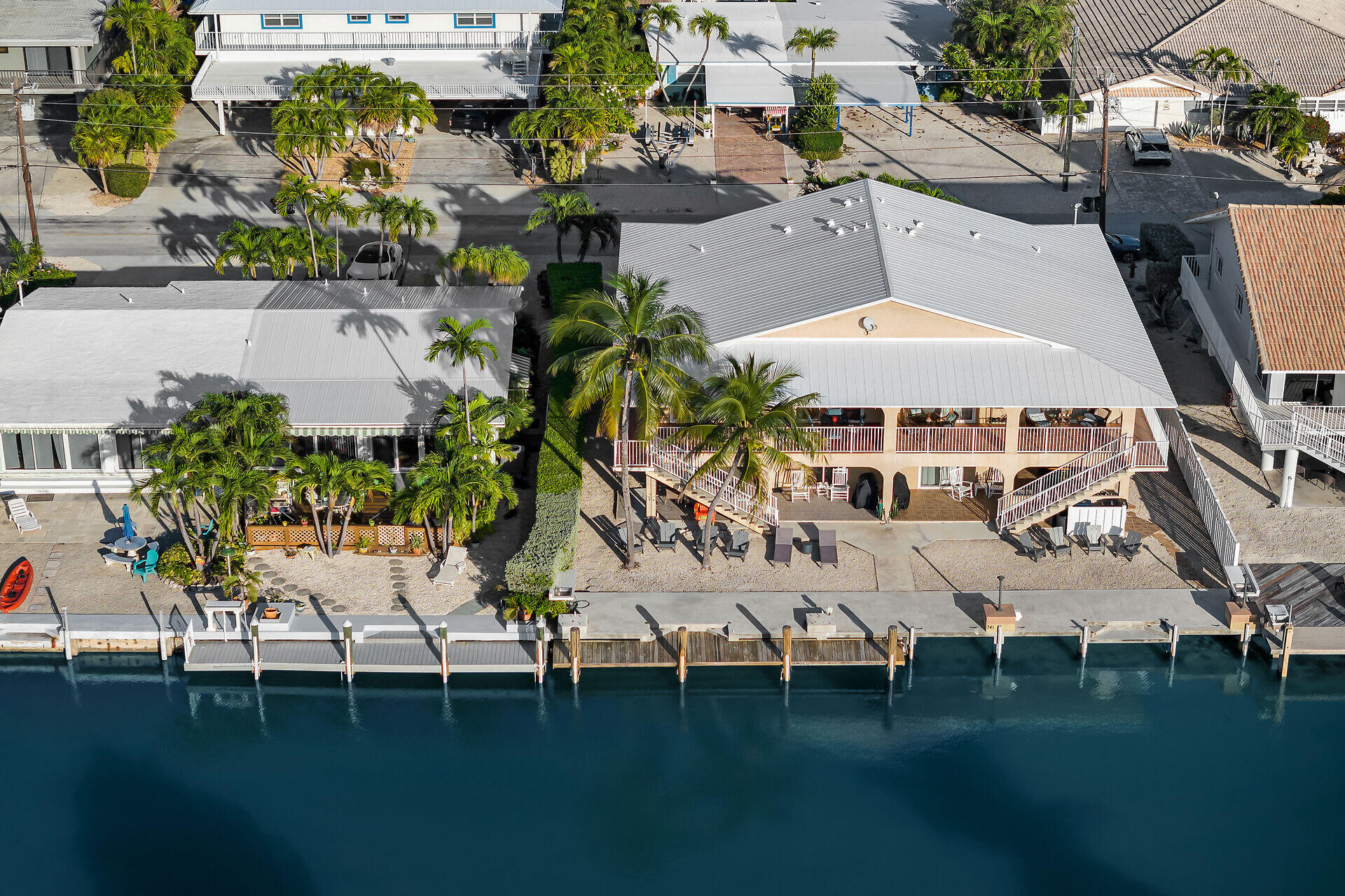 351 10th Street Key Colony Beach, FL 33051 - Photo 31 of 47 an aerial view of a house with outdoor space pool seating area and yard