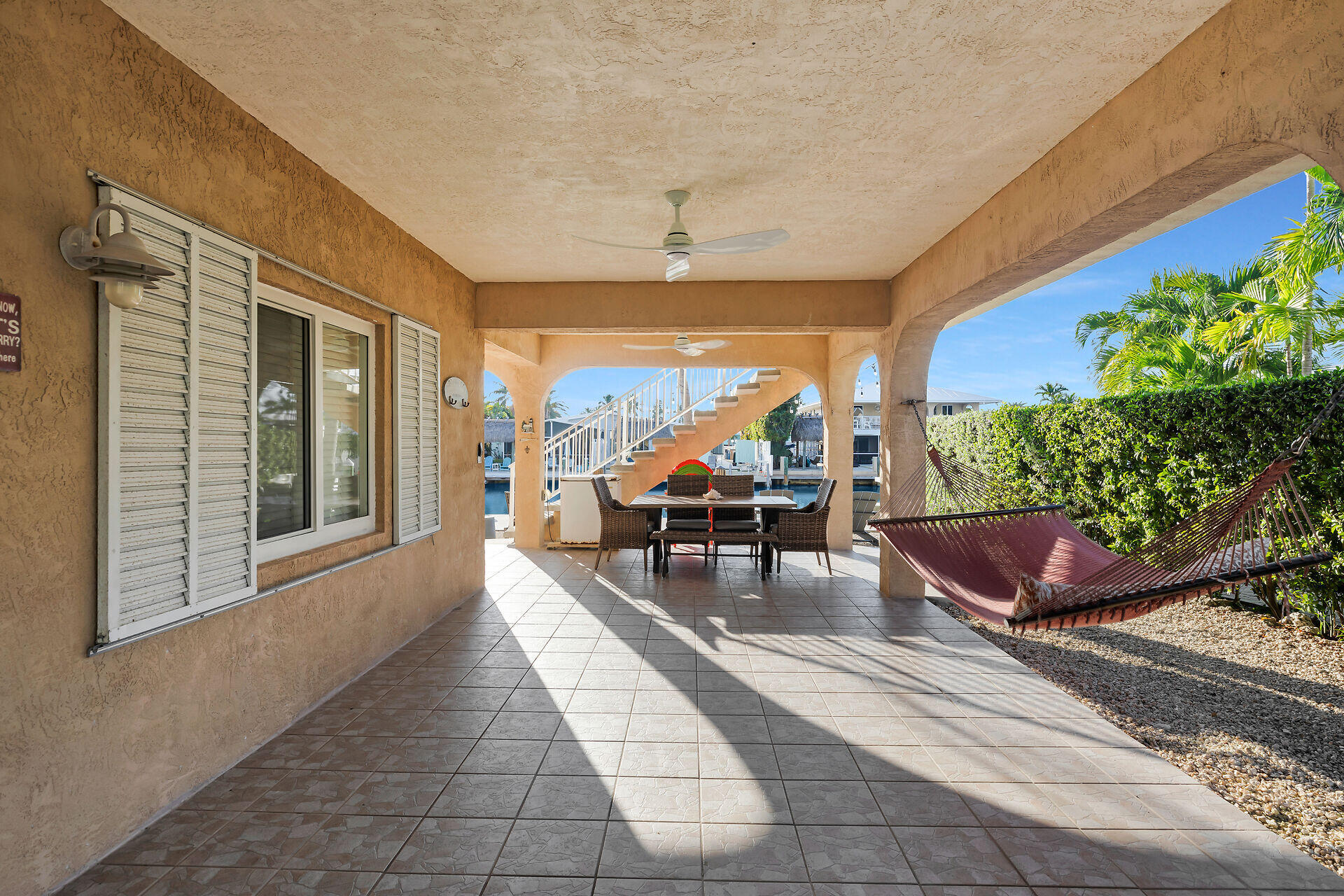 351 10th Street Key Colony Beach, FL 33051 - Photo 36 of 47 a living room with furniture and a potted plant
