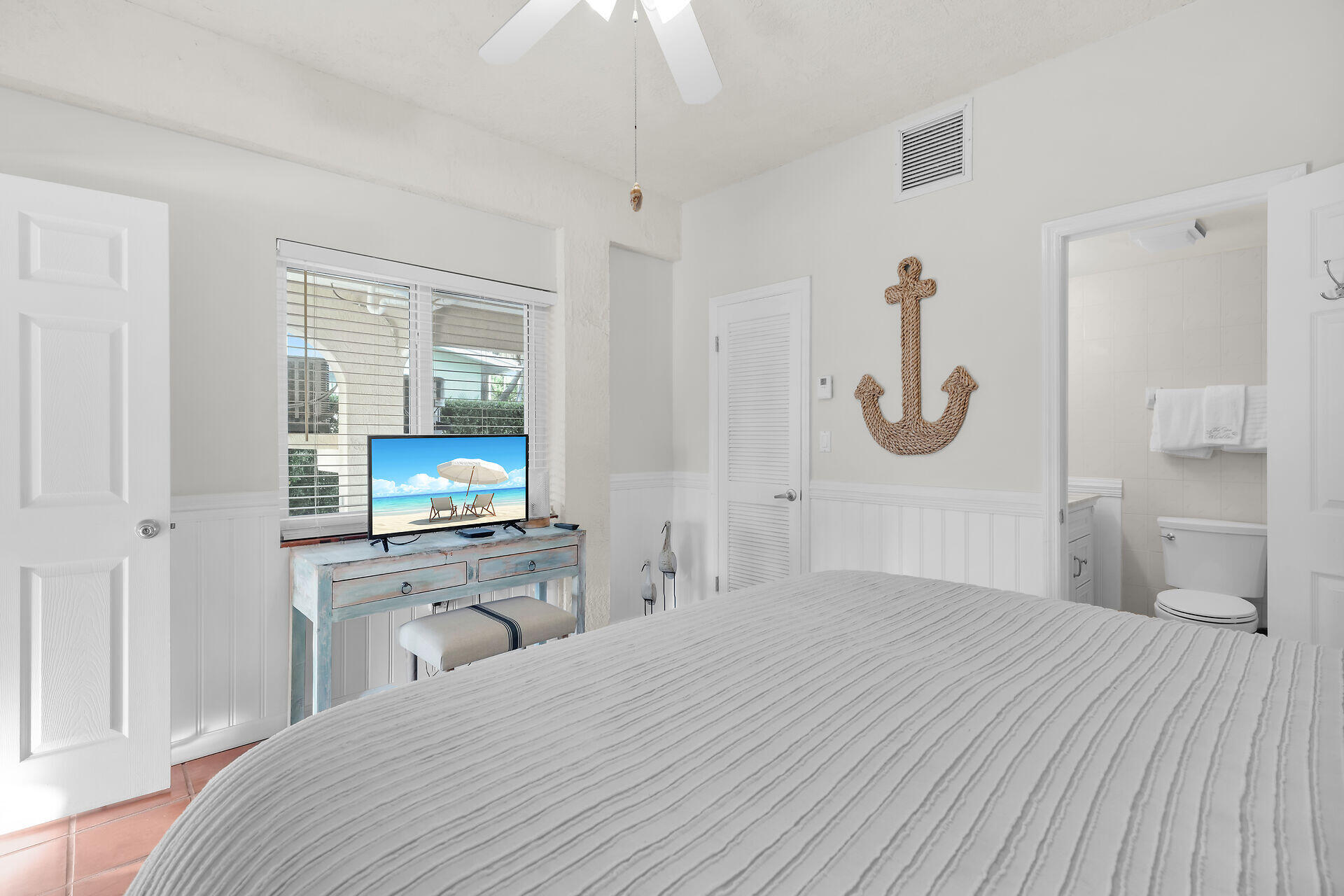 351 10th Street Key Colony Beach, FL 33051 - Photo 41 of 47 a bedroom with a bed and a flat screen tv