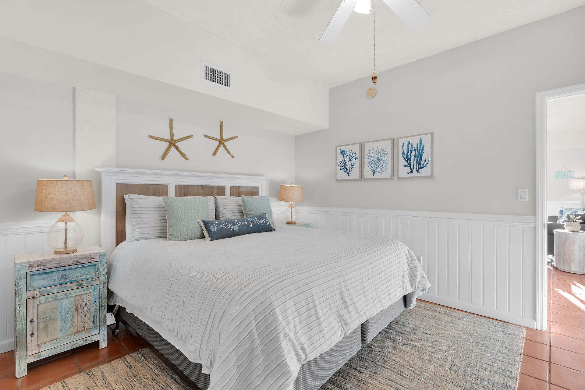 351 10th Street Key Colony Beach, FL 33051 - Photo 42 of 47 a bedroom with double bed and a chandelier