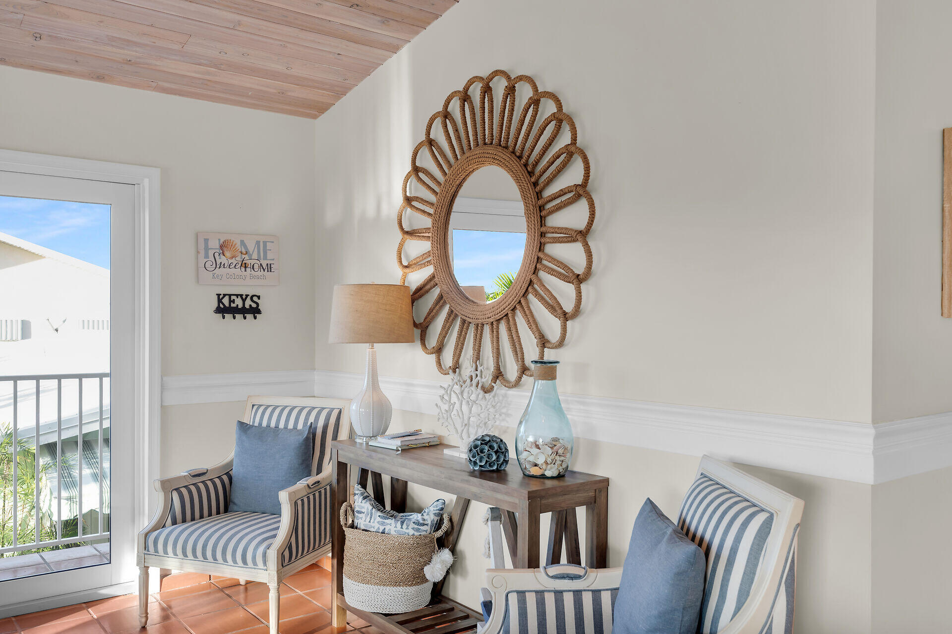351 10th Street Key Colony Beach, FL 33051 - Photo 5 of 47 a view of a dining room with furniture a chandelier and wooden floor