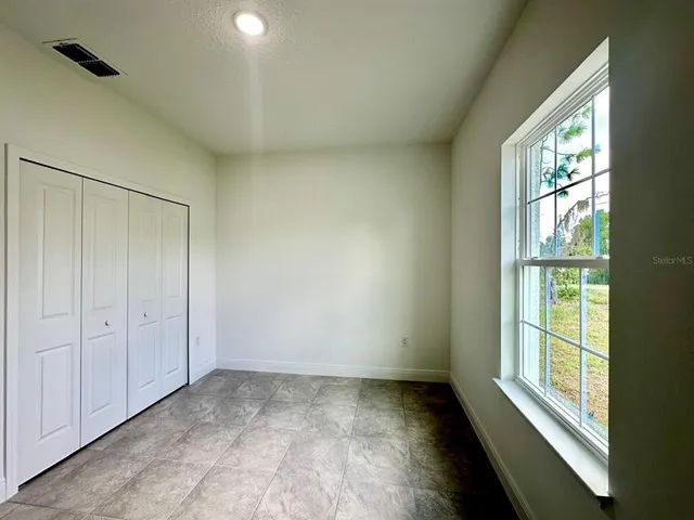 an empty room with windows
