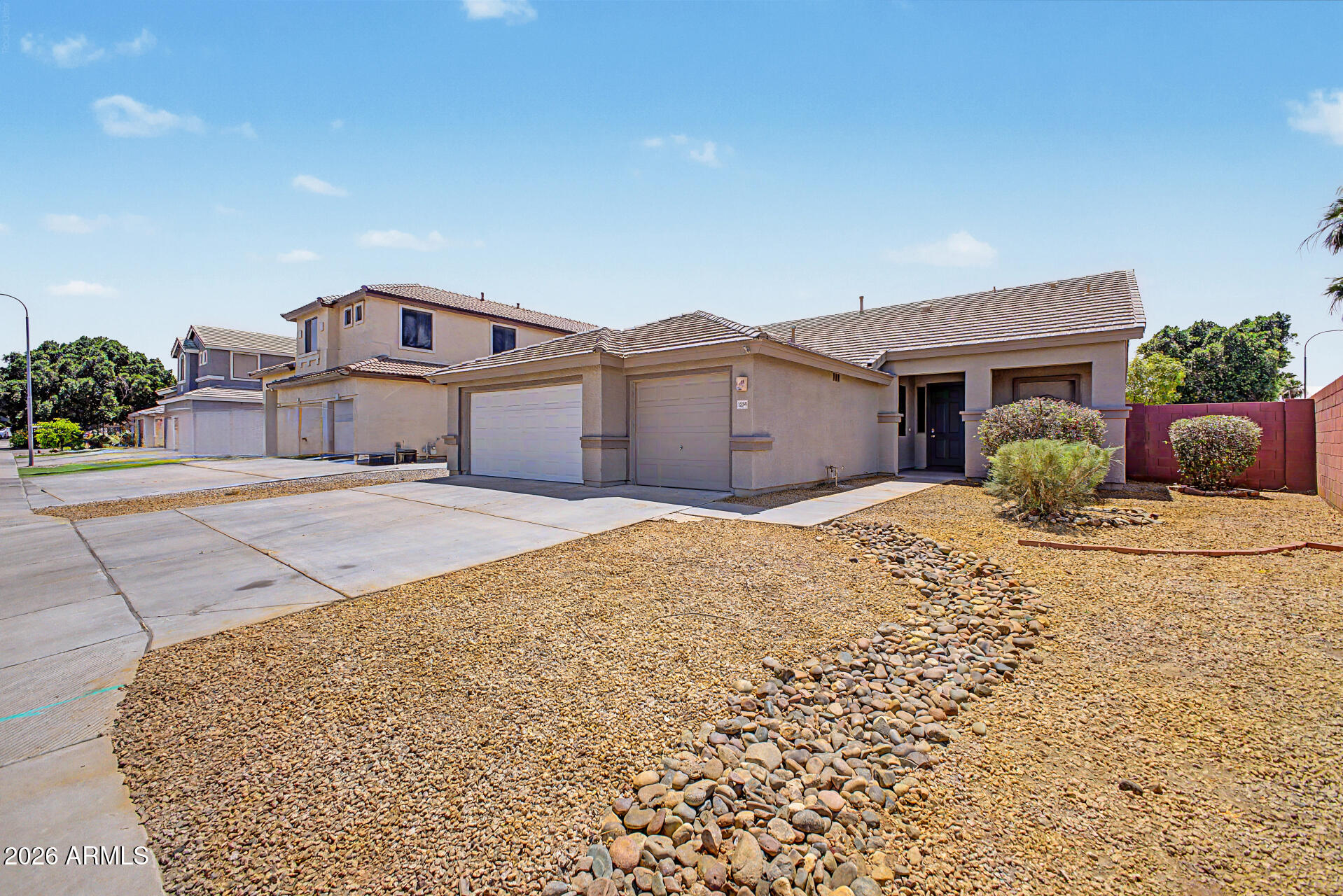 11199 West Monte Vista Road Avondale, AZ 85392 - Photo 36 of 36 a front view of a house with a yard