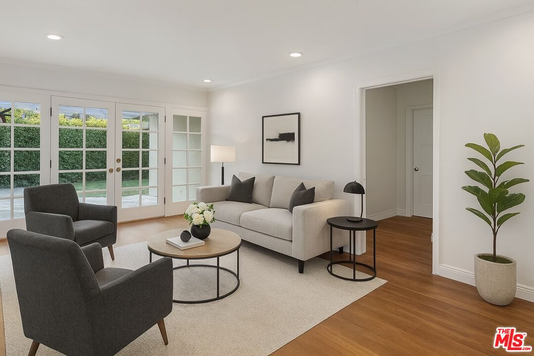 10517 Holman Avenue Los Angeles, CA 90024 - Photo 3 of 7 a living room with furniture and a large window