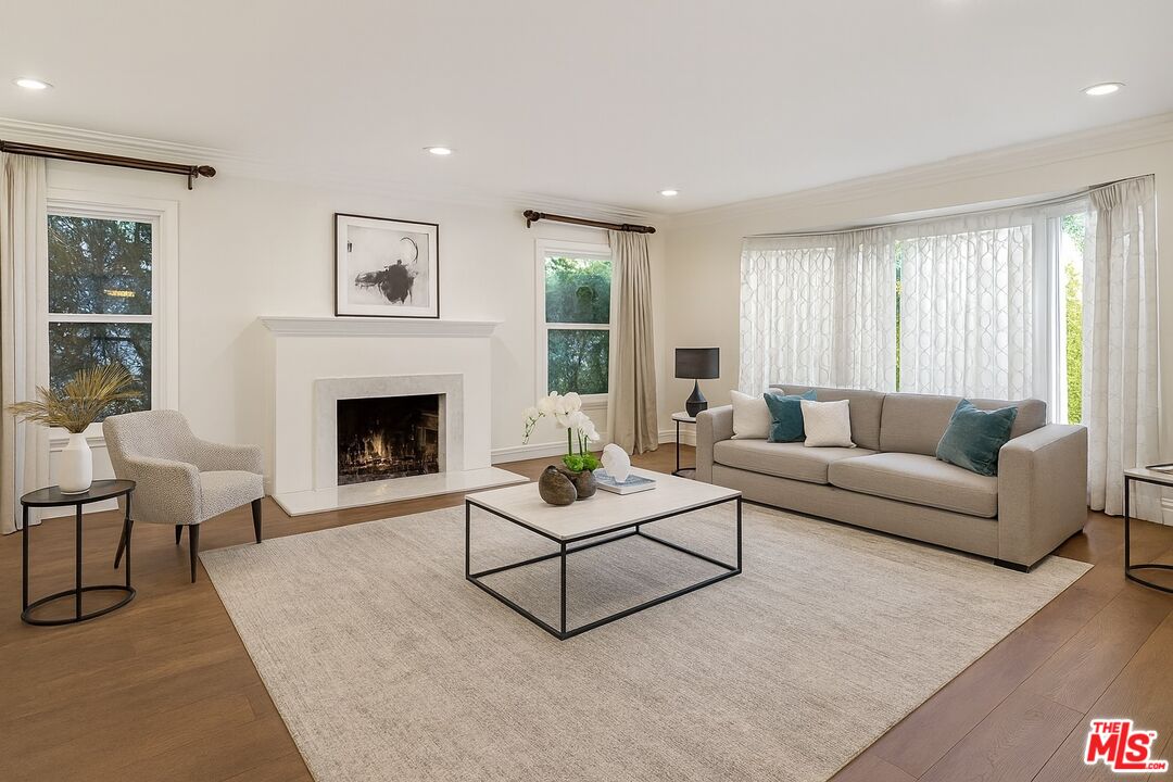 10517 Holman Avenue Los Angeles, CA 90024 - Photo 4 of 7 a living room with furniture and a fireplace