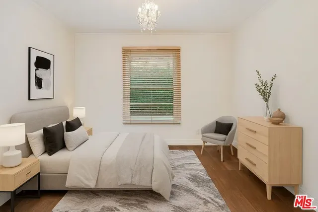 a bedroom with bed and window