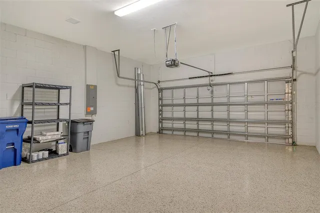 an aerial view of a house with a lake view