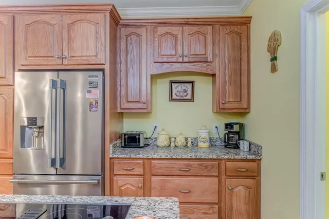 a bedroom with a large bed and a dresser