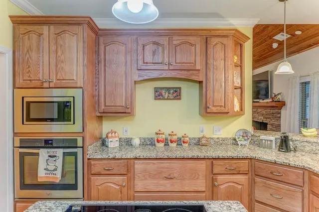 a bathroom with a sink a toilet and shower curtain