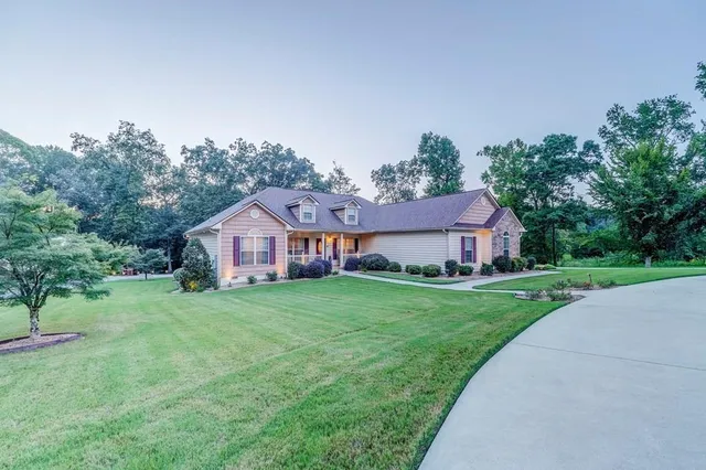 a front view of a house with a yard