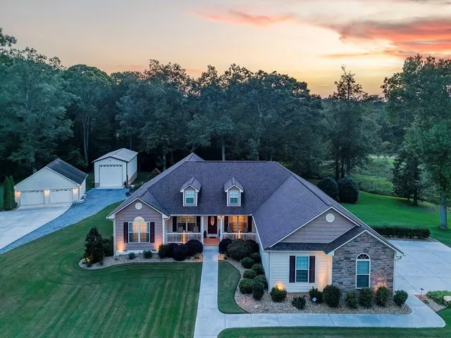 a view of a chair and tables in the balcony