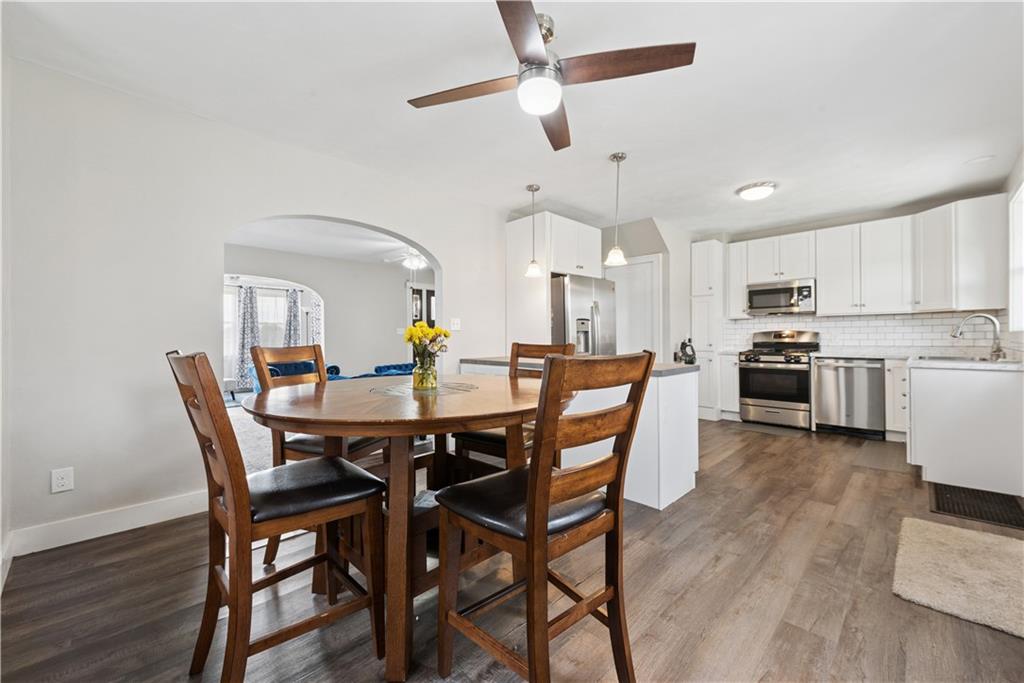 53 Calhoun Avenue Pittsburgh, PA 15210 - Photo 8 of 30 a view of a dining room with furniture and wooden floor